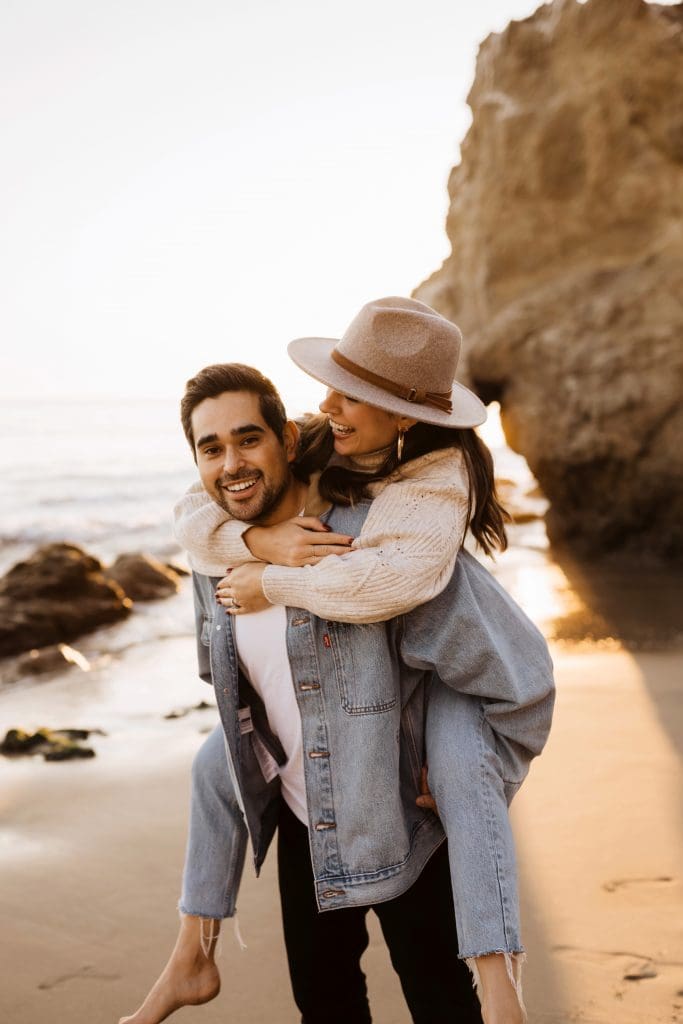 Happy Couple During Malibu Beach Engagement Session | Kelly O'Connor Photography | Austin Based Wedding Photographer | El Matador Beach | couples poses, couple smiling at each other, beach photos, casual beach photos, outfit ideas for engagement photos, outfit ideas for beach | via kellyoconnorphotography.com