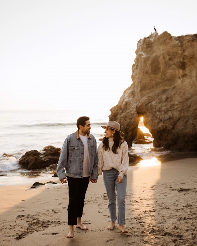 Happy Couple During Malibu Beach Engagement Session | Kelly O'Connor Photography | Austin Based Wedding Photographer | El Matador Beach | couples poses, couple smiling at each other, beach photos, casual beach photos, outfit ideas for engagement photos, outfit ideas for beach | via kellyoconnorphotography.com