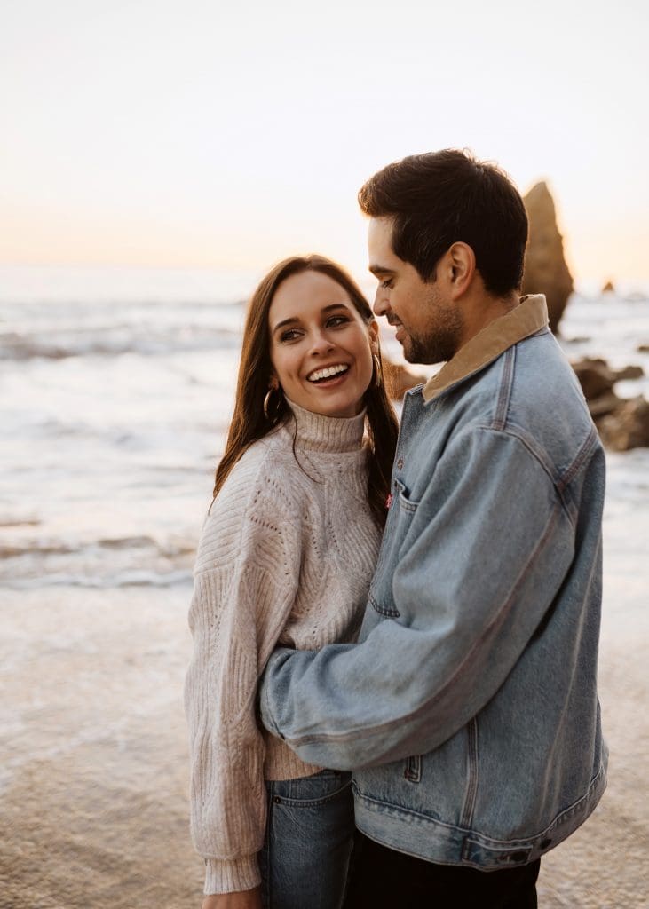 Happy Couple During Malibu Beach Engagement Session | Kelly O'Connor Photography | Austin Based Wedding Photographer | El Matador Beach | couples poses, couple smiling at each other, beach photos, casual beach photos, outfit ideas for engagement photos, outfit ideas for beach | via kellyoconnorphotography.com