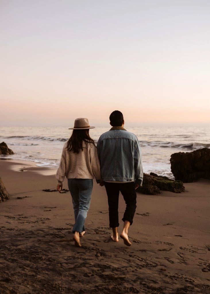 Happy Couple During Malibu Beach Engagement Session | Kelly O'Connor Photography | Austin Based Wedding Photographer | El Matador Beach | couples poses, couple smiling at each other, beach photos, casual beach photos, outfit ideas for engagement photos, outfit ideas for beach | via kellyoconnorphotography.com