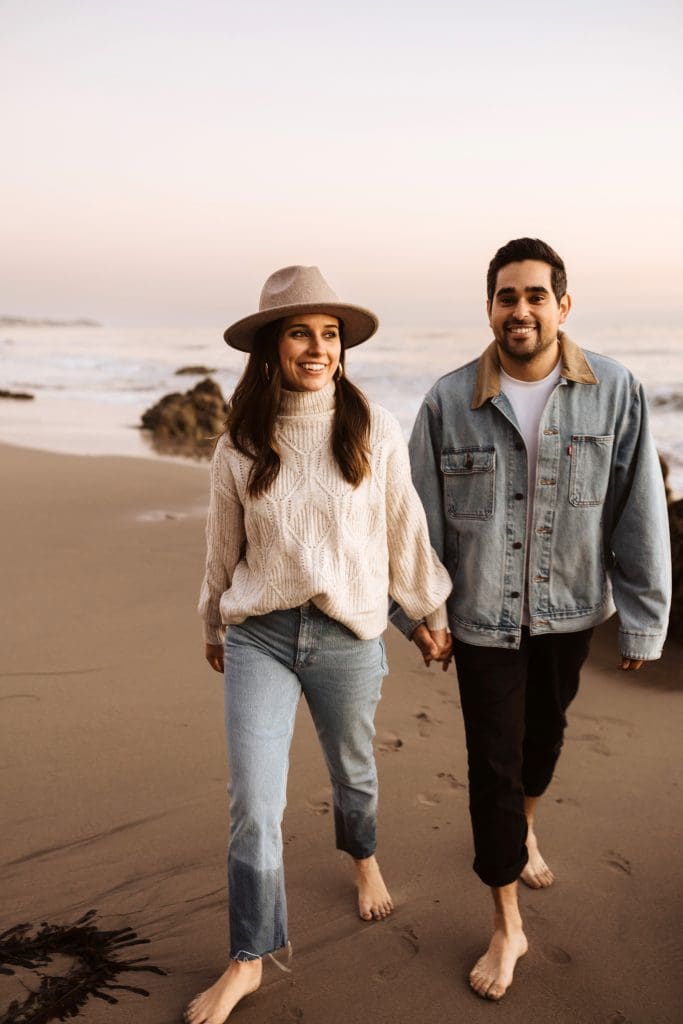 Happy Couple During Malibu Beach Engagement Session | Kelly O'Connor Photography | Austin Based Wedding Photographer | El Matador Beach | couples poses, couple smiling at each other, beach photos, casual beach photos, outfit ideas for engagement photos, outfit ideas for beach | via kellyoconnorphotography.com