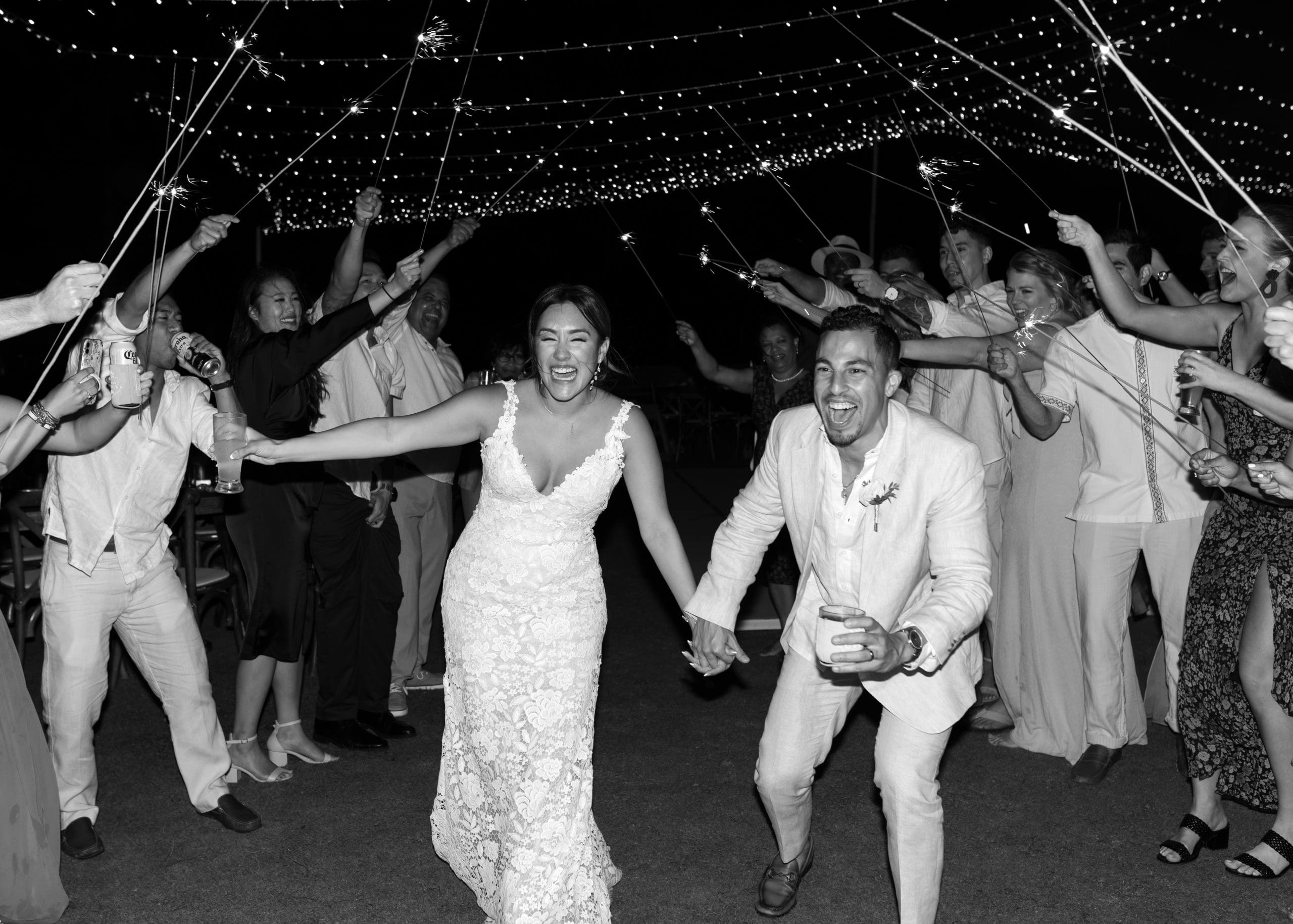 Outdoor wedding reception under draped lights in Mexico | Kelly O'Connor Photography | Destination Wedding Photographer | Dreams Playa Mujeres Wedding | first dance, reception photos, guests dancing | via kellyoconnorphotography.com
