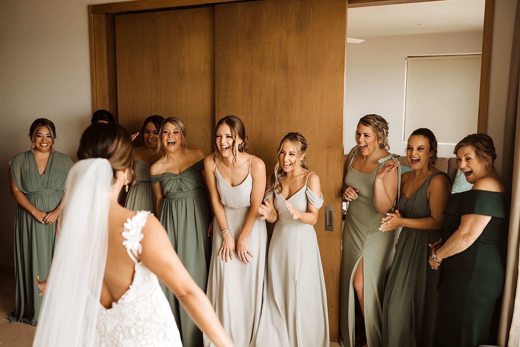 First look with bridesmaids on wedding day | Beach Wedding at Dreams Playa Mujeres in Cancun | Kelly O'Connor Photography | Destination Wedding Photographer | wedding photography, beach wedding, Mexico destination wedding | via kellyoconnorphotography.com