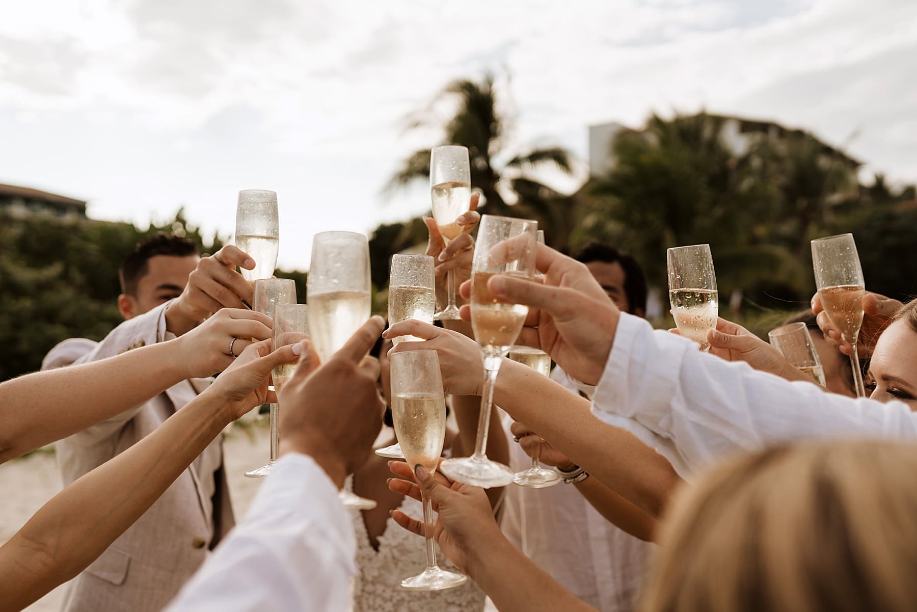Wedding party cheers-ing champagne after ceremony