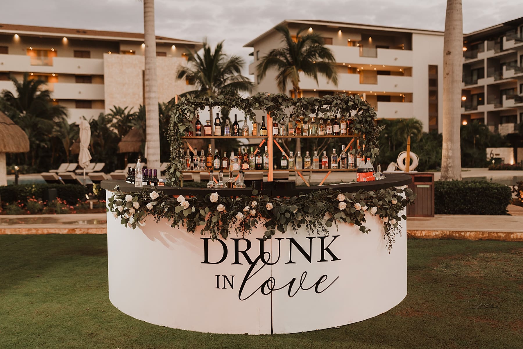 Wedding Day Details at Cancun Destination Wedding  | Kelly O'Connor Photography | Destination Wedding Photographer | Dreams Playa Mujeres Wedding | wedding photography, beach wedding, Mexico destination wedding, reception signs, table setting, wedding decor, greenery decor, classic decor, drunk in love bar setup | via kellyoconnorphotography.com