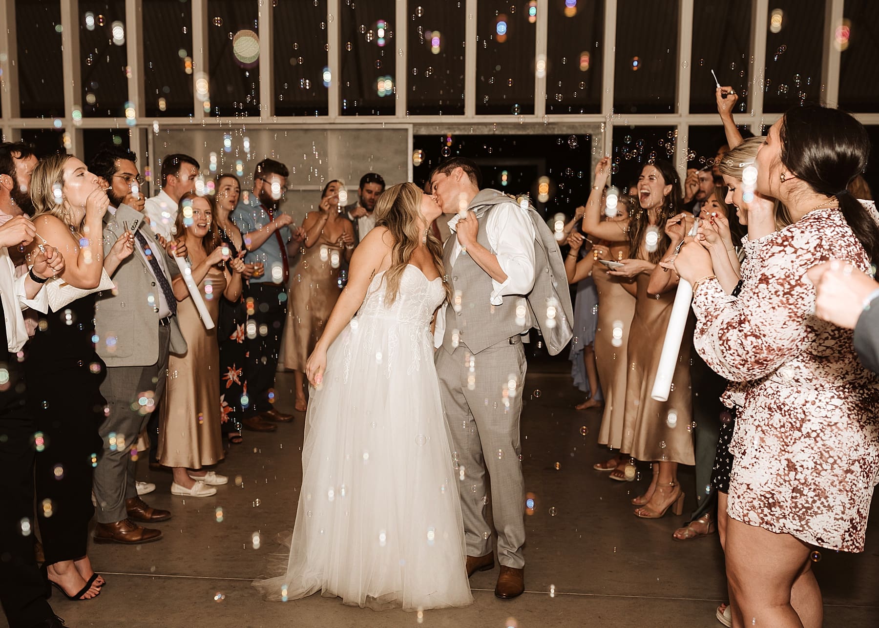 Bubble grand exit at rainy wedding day | Kelly O'Connor Photography | Austin Wedding Photographer | Prospect House Wedding Day | edgy wedding ideas, bride in converse | via kellyoconnorphotography.com