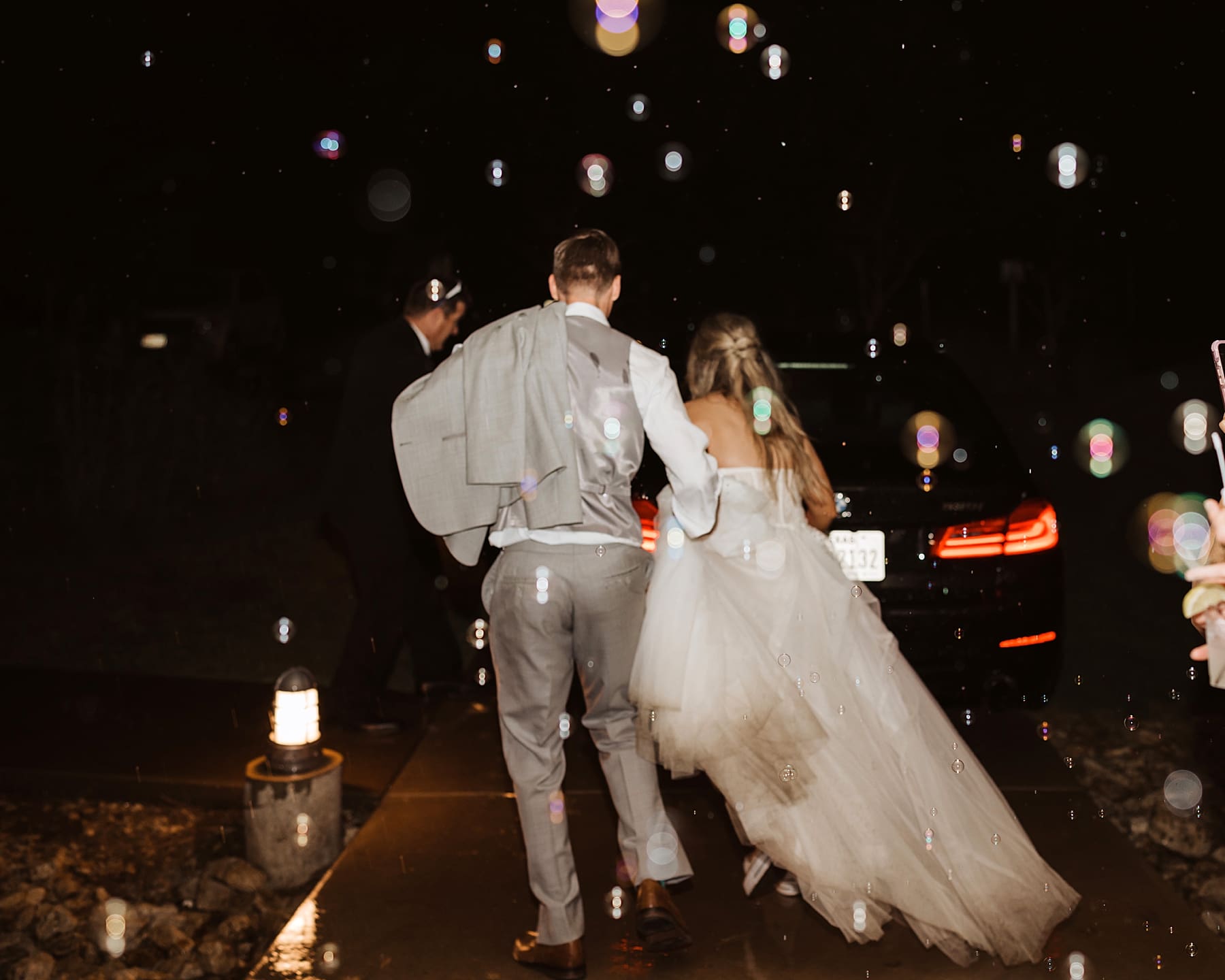 Bubble grand exit at rainy wedding day | Kelly O'Connor Photography | Austin Wedding Photographer | Prospect House Wedding Day | edgy wedding ideas, bride in converse | via kellyoconnorphotography.com