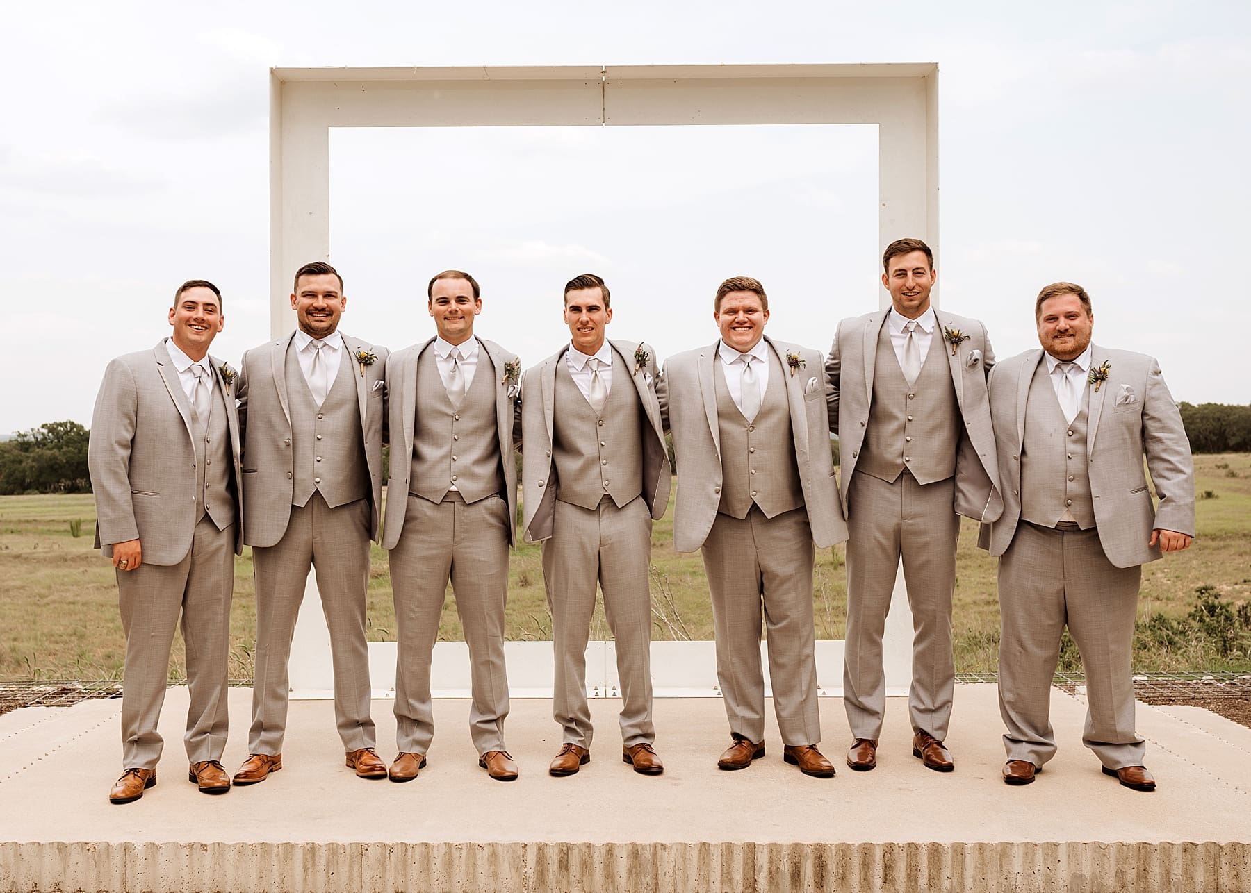 Groomsmen getting ready on wedding day | Kelly O'Connor Photography | Austin Wedding Photographer | Prospect House Wedding Day | edgy wedding ideas, groom and groomsmen fun socks, outfit attire for groomsmen, groom in suite | via kellyoconnorphotography.com