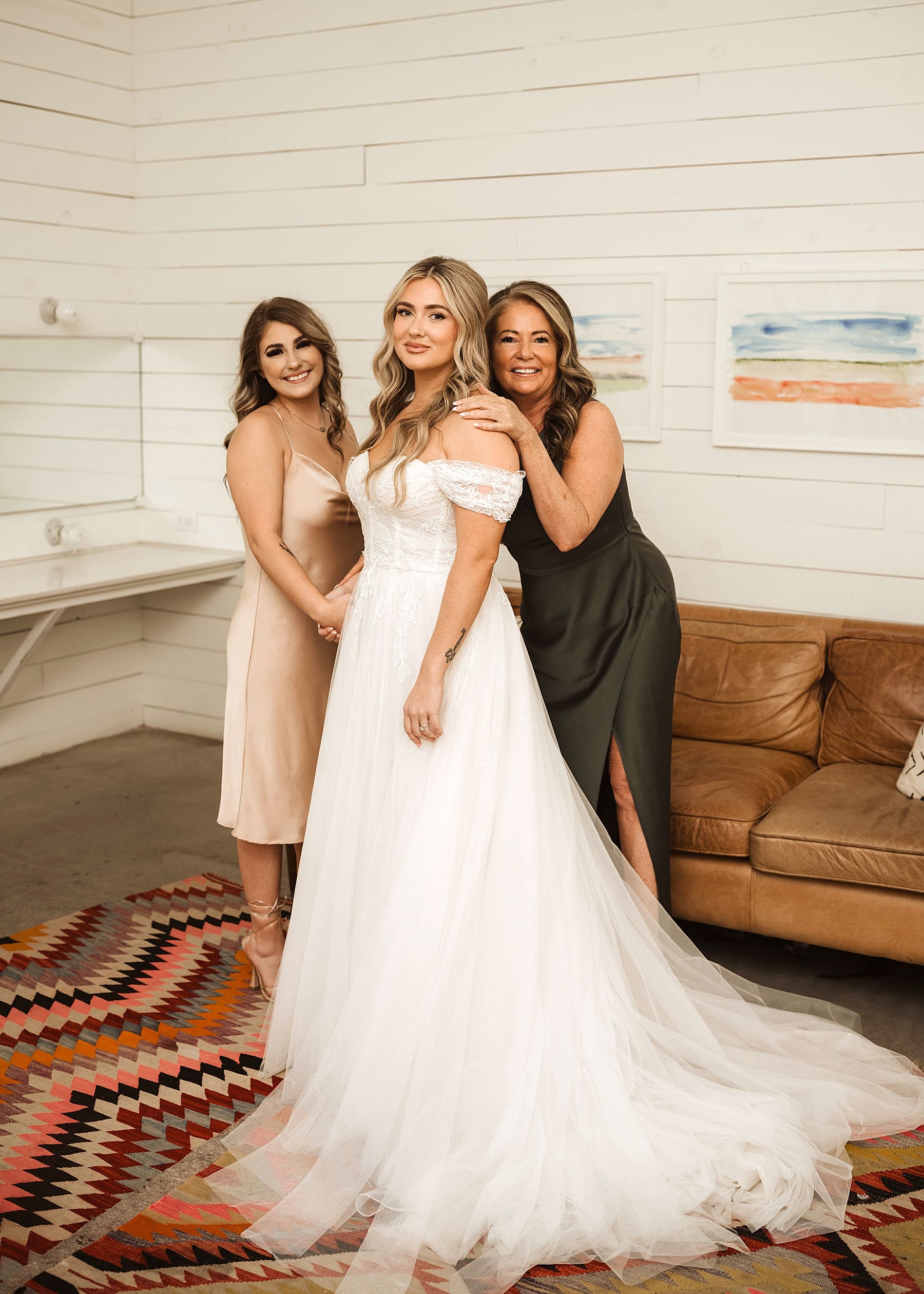 Bride getting ready with bridesmaids on wedding day | Kelly O'Connor Photography | Austin Wedding Photographer | Prospect House Wedding Day | edgy wedding ideas, bride putting on lipstick, bride in converse | via kellyoconnorphotography.com