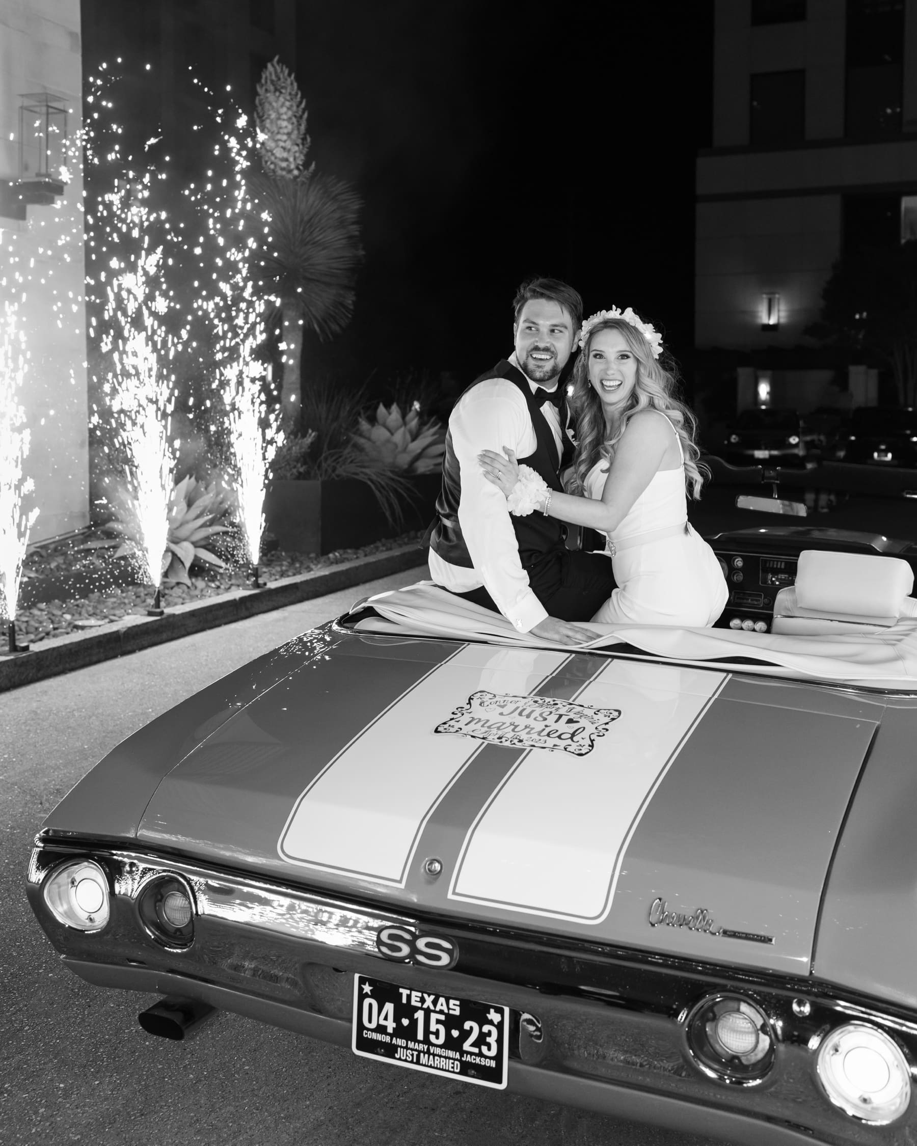 A vintage car wedding send off with a twist - cold sparklers! Loved the joy on their faces when they were surprised with this. | Spring Wedding in Texas | Kelly O'Connor Photography