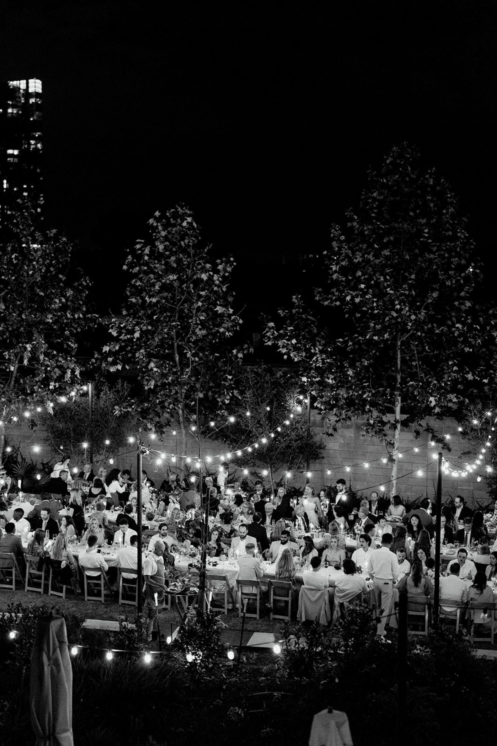 Outdoor wedding reception under twinkle lights in Hotel Magdelena courtyard in Austin, Texas. | Kelly O'Connor Photography