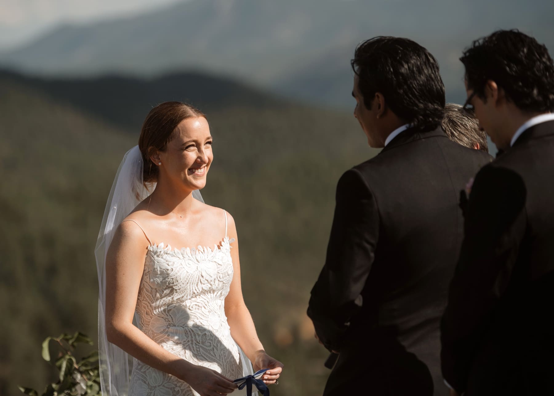 Bride looking at groom during destination Colorado wedding ceremony 