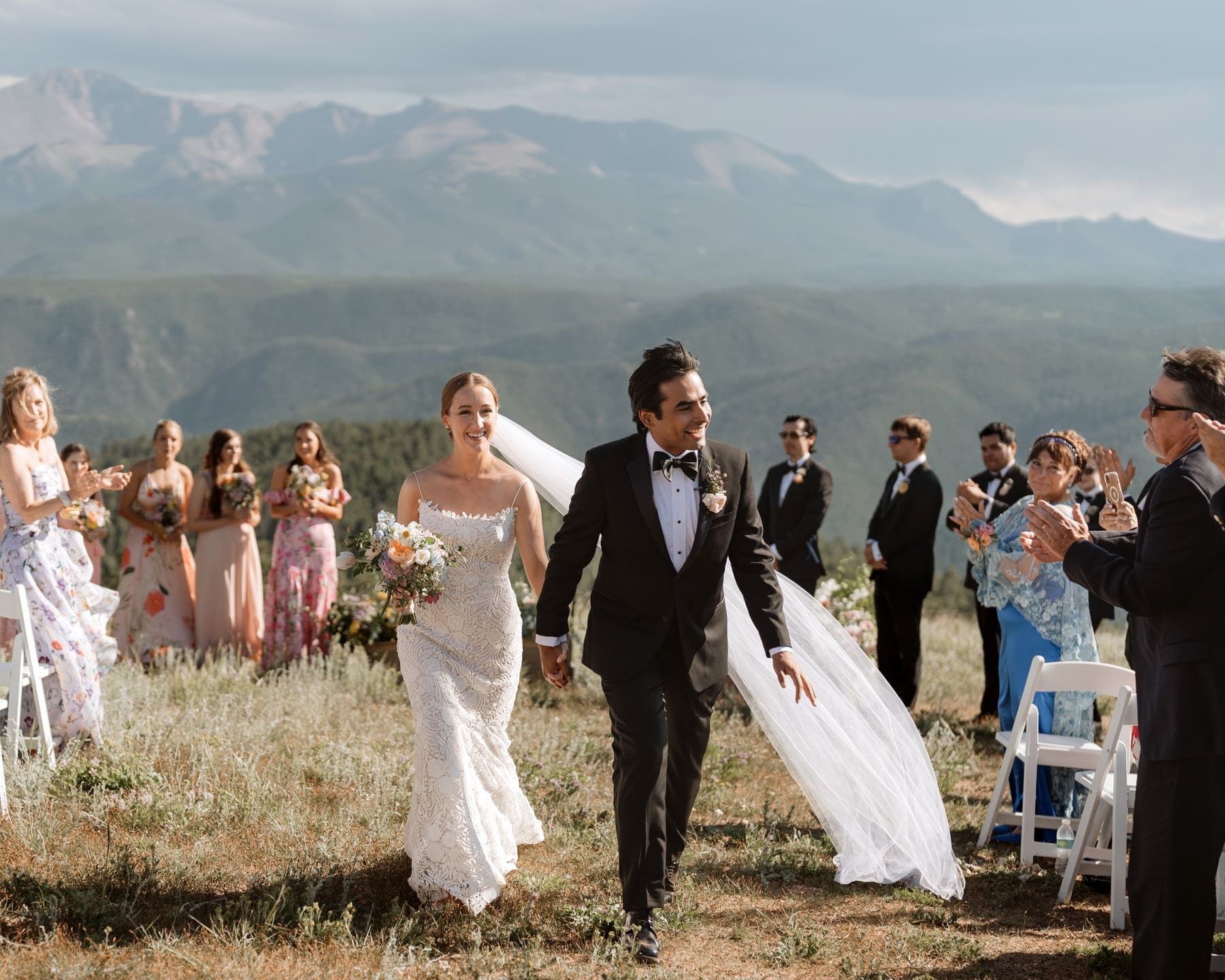 Bride and groom existing wedding ceremony in Colorado mountains 