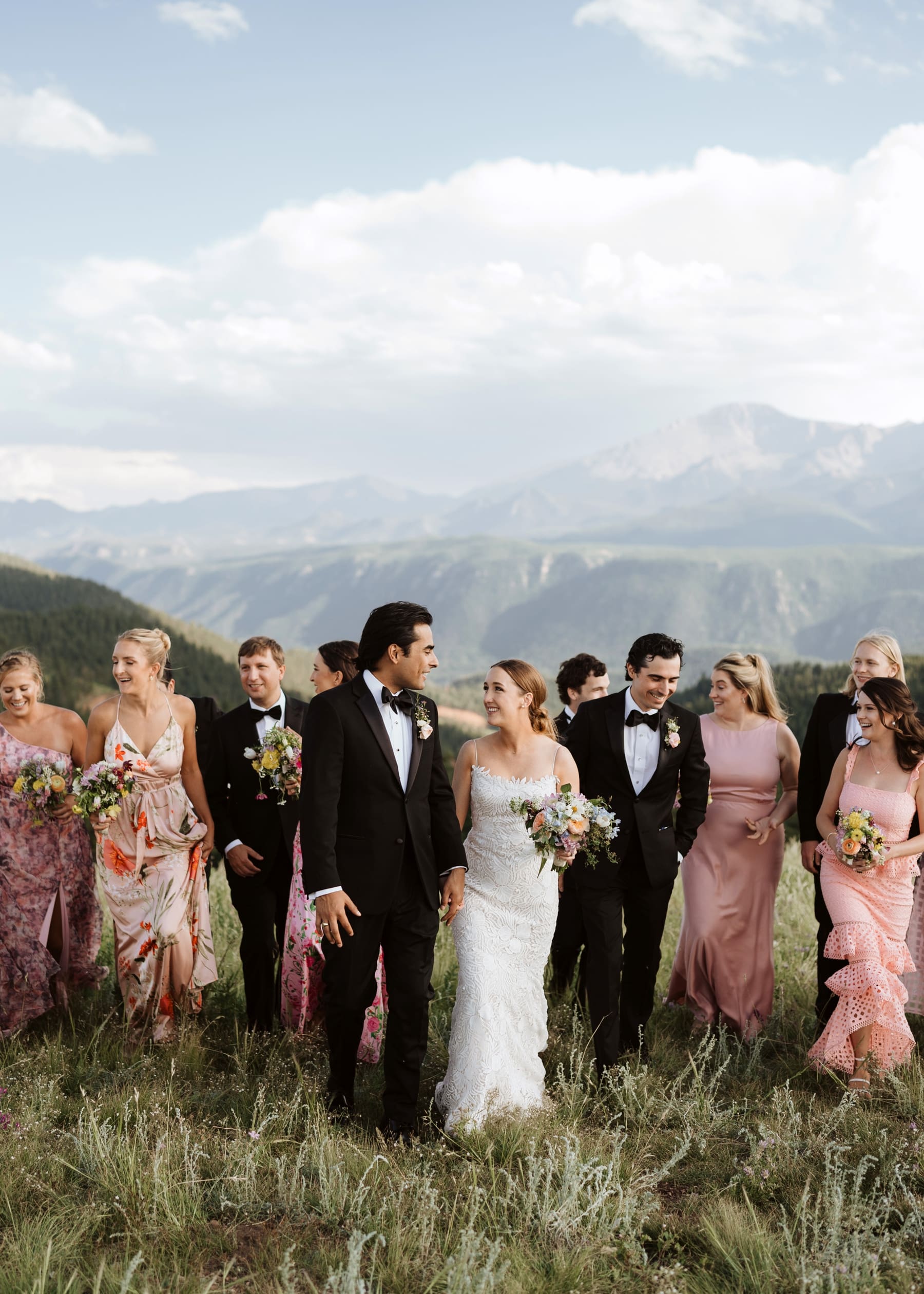 Bride and groom walking with wedding party at destination Colorado wedding 