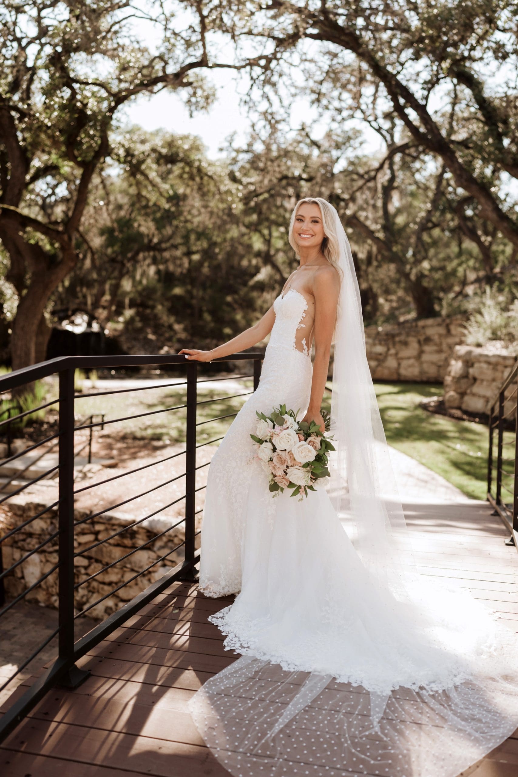 Bride standing on bridge at Hayes Hollow at Hidden Falls during bridal portraits