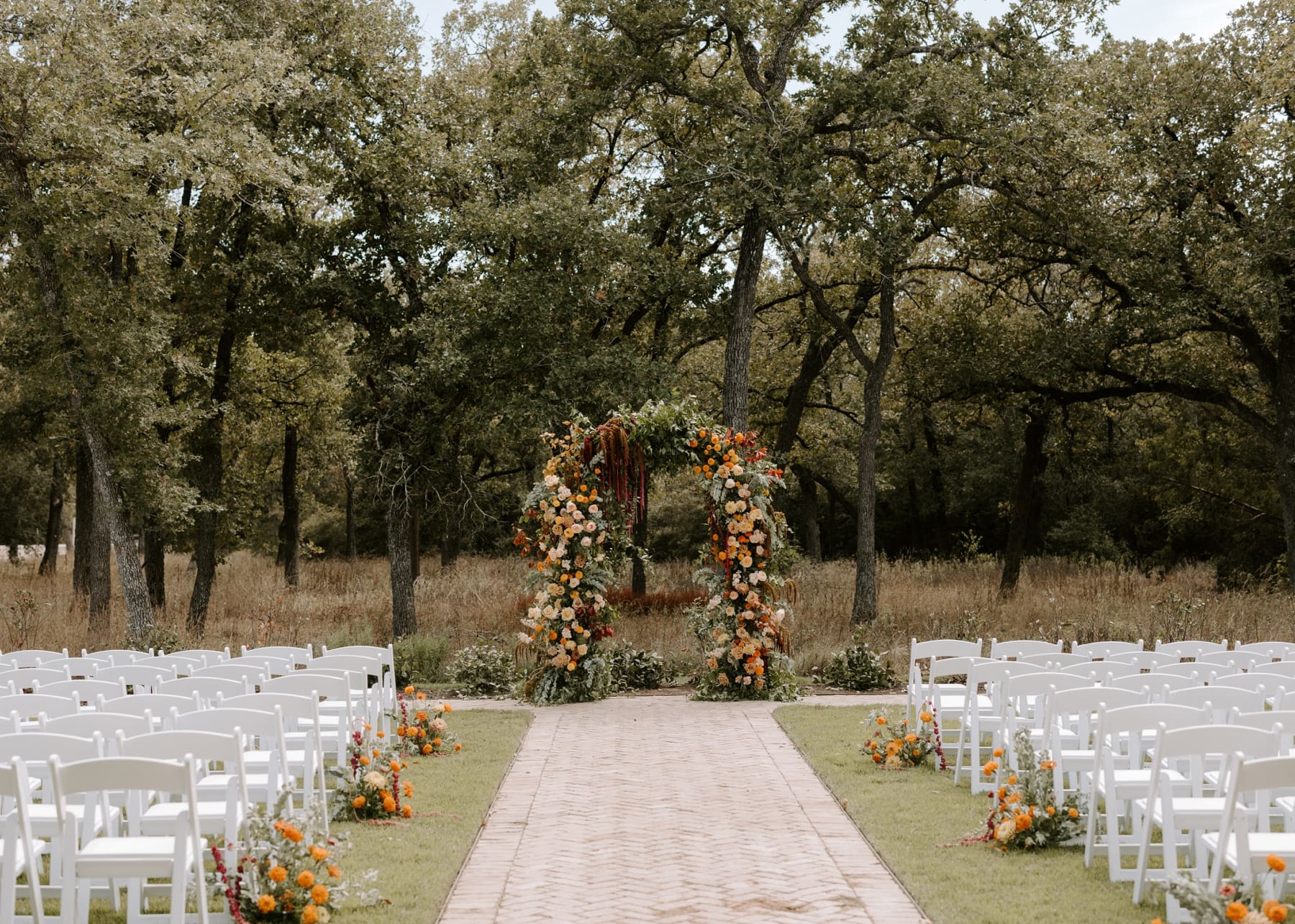 Ceremony site at The Grand Lady Austin featuring boho floral arch