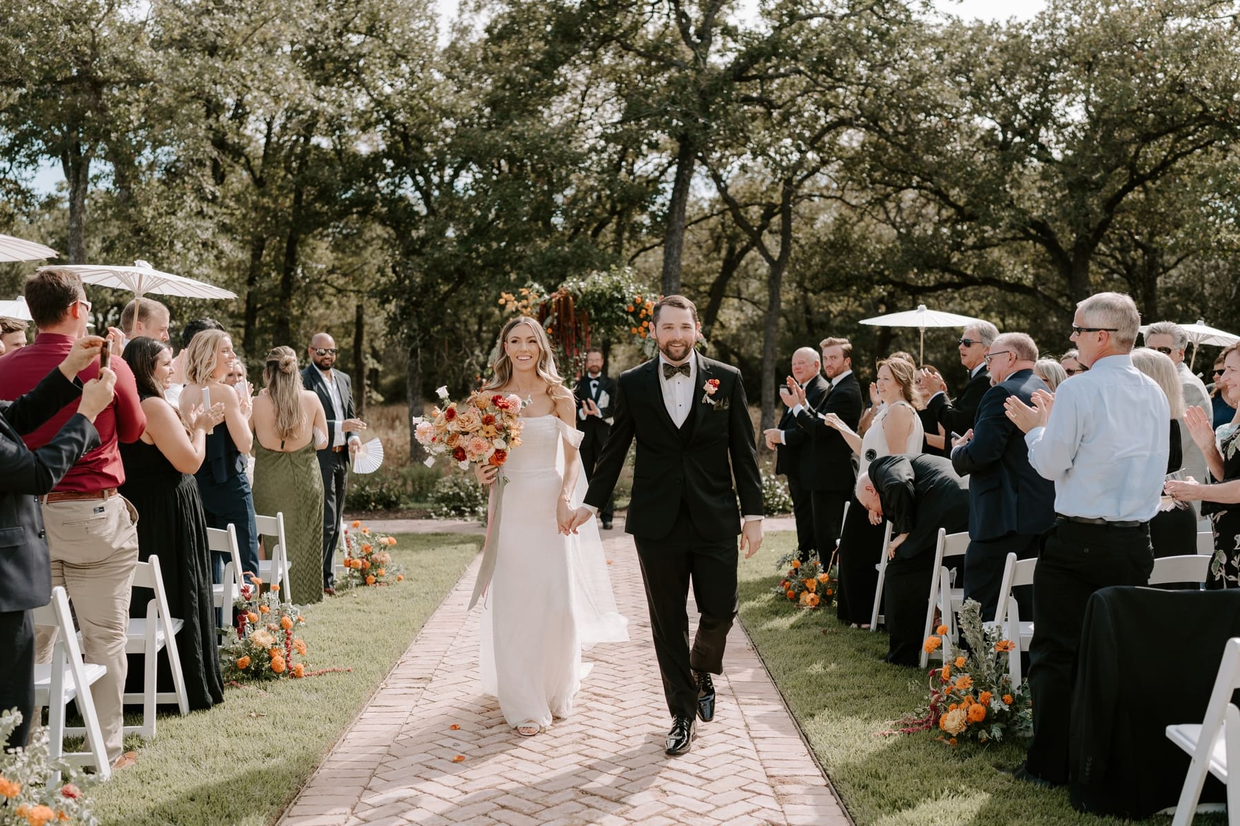 Bride and groom exiting ceremony at The Grand Lady Austin