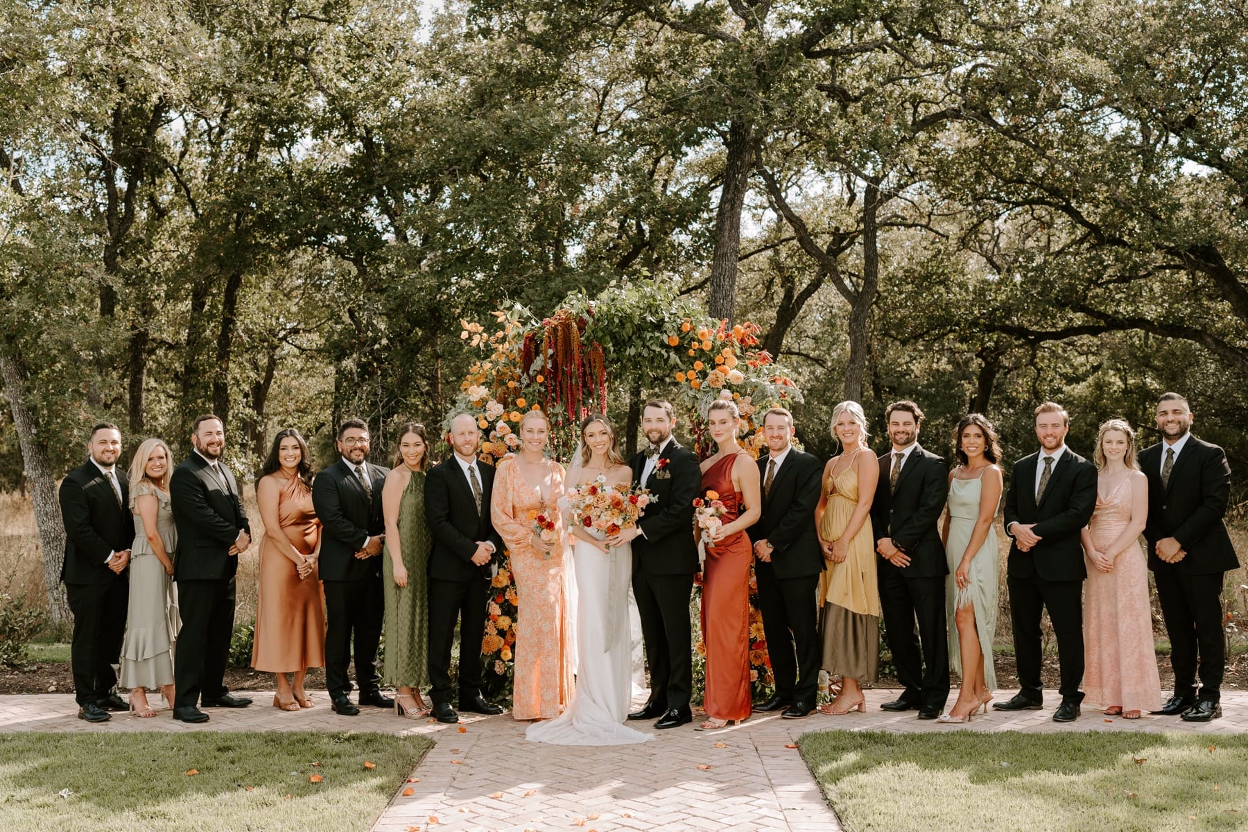 Wedding party standing next to bride and groom at The Grand Lady Austin